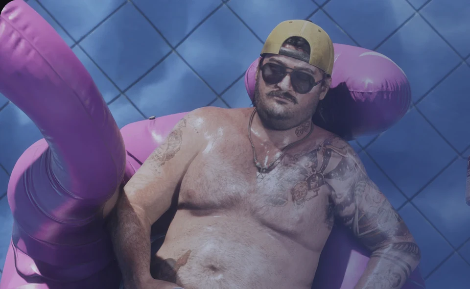 Leonida local relaxing on a pink inflatable pool float